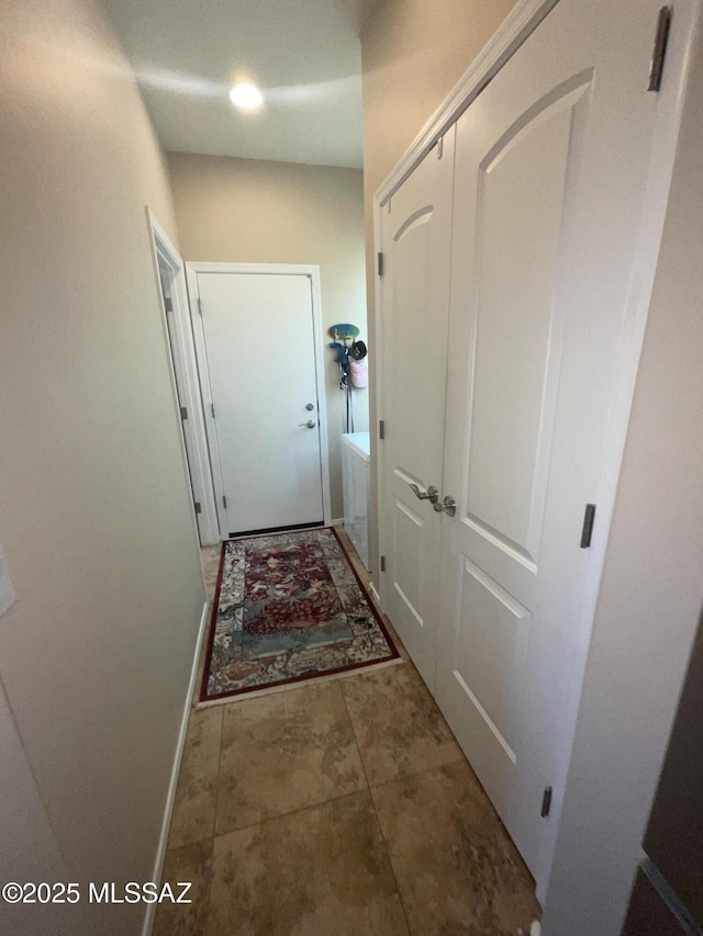 doorway to outside with tile patterned flooring