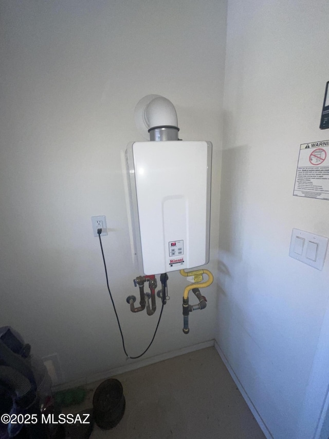 utility room featuring water heater