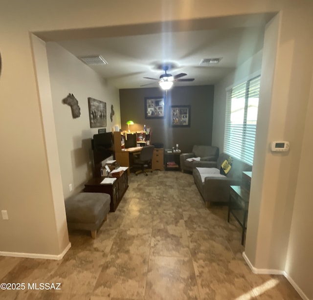 interior space featuring ceiling fan