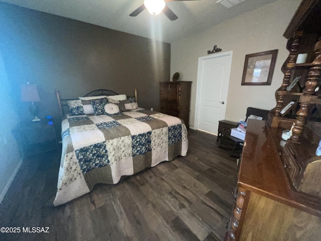 bedroom with ceiling fan and dark hardwood / wood-style floors