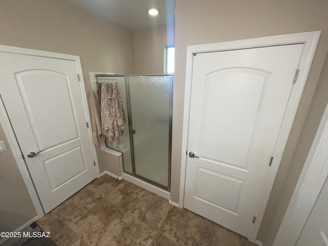 bathroom featuring an enclosed shower