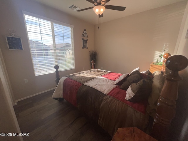 bedroom with dark wood-type flooring and ceiling fan