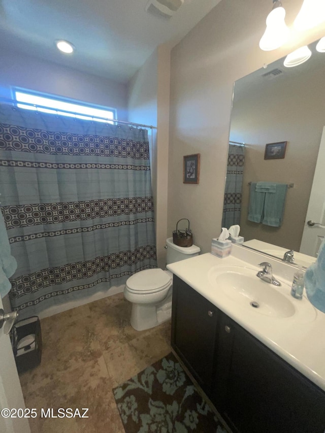 bathroom featuring vanity, a shower with curtain, and toilet