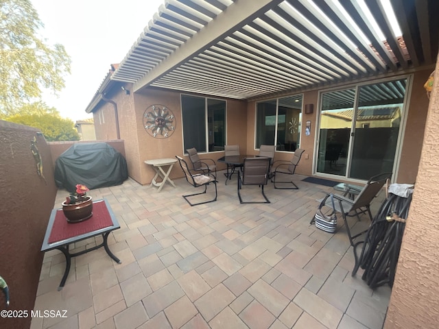 view of patio featuring area for grilling and a pergola