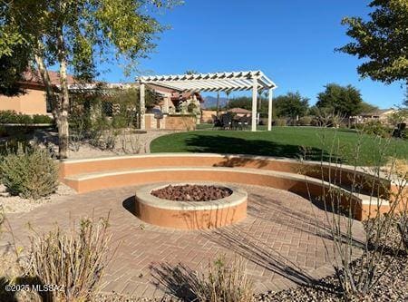 view of home's community featuring a pergola and a fire pit