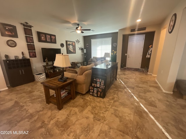 living room featuring ceiling fan