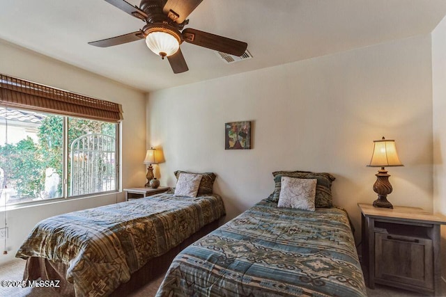 bedroom featuring ceiling fan and visible vents