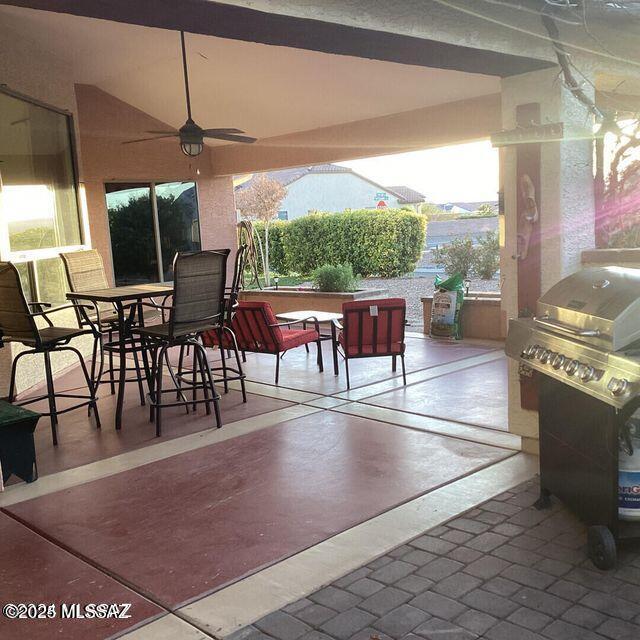 view of patio / terrace with ceiling fan and outdoor dining area