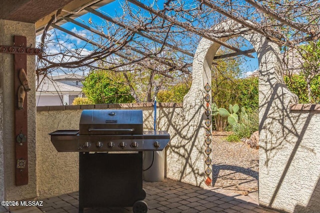 view of patio / terrace featuring fence and grilling area