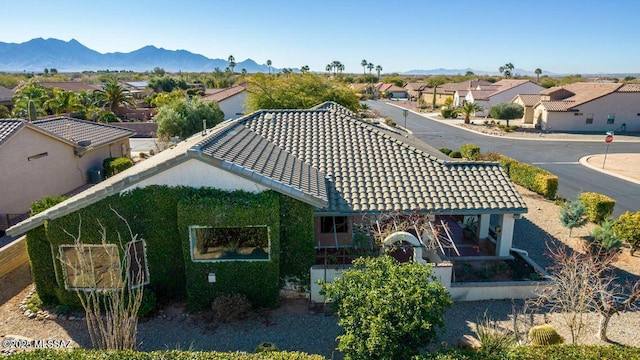 birds eye view of property with a mountain view and a residential view