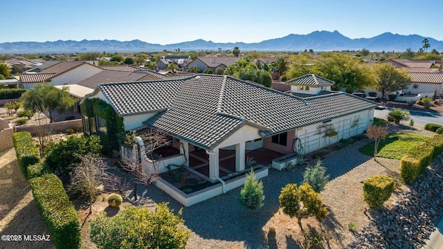 birds eye view of property with a residential view and a mountain view