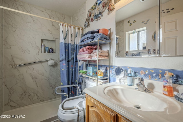 bathroom featuring vanity, toilet, and a shower with shower curtain
