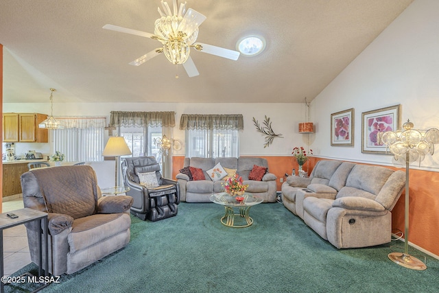 carpeted living room featuring ceiling fan, lofted ceiling, and a textured ceiling