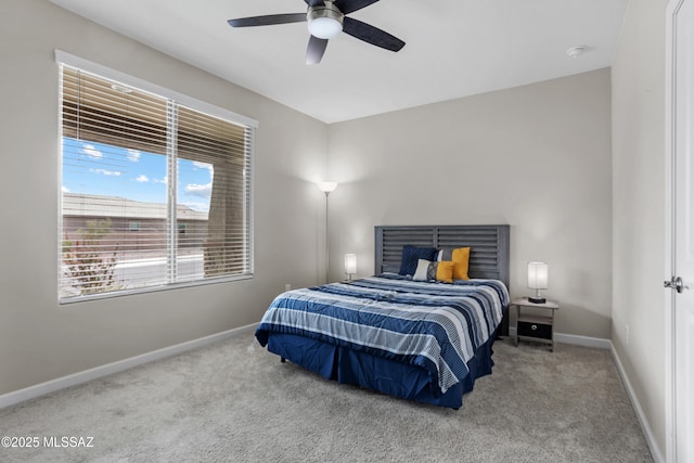 bedroom with carpet, ceiling fan, and baseboards