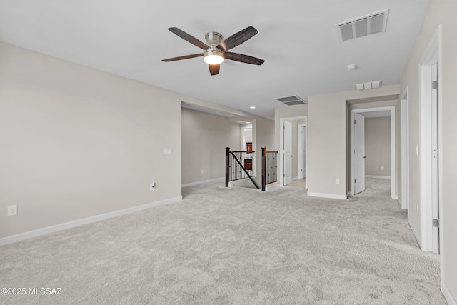 empty room with visible vents and baseboards