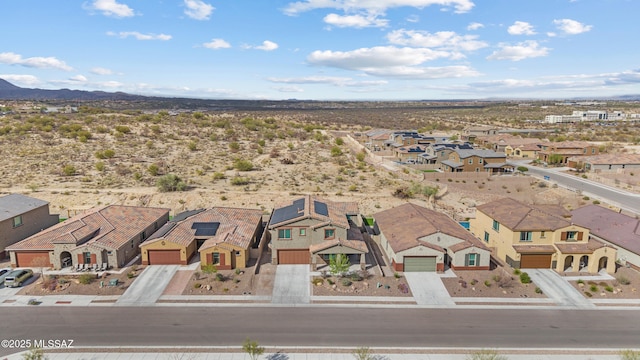 birds eye view of property with a residential view and a mountain view