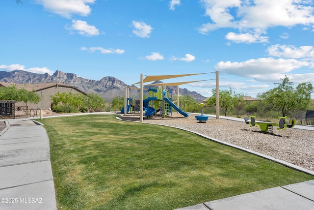 community playground featuring a yard and a mountain view