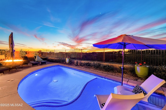 view of pool featuring a fenced backyard and a jacuzzi