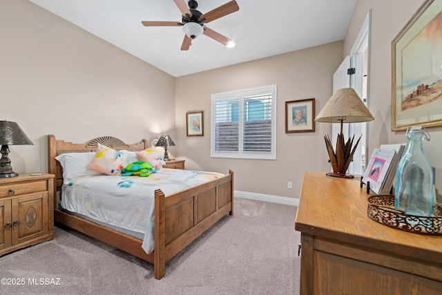 bedroom featuring baseboards, a ceiling fan, and light colored carpet