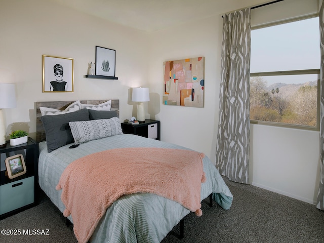 bedroom with carpet floors and baseboards