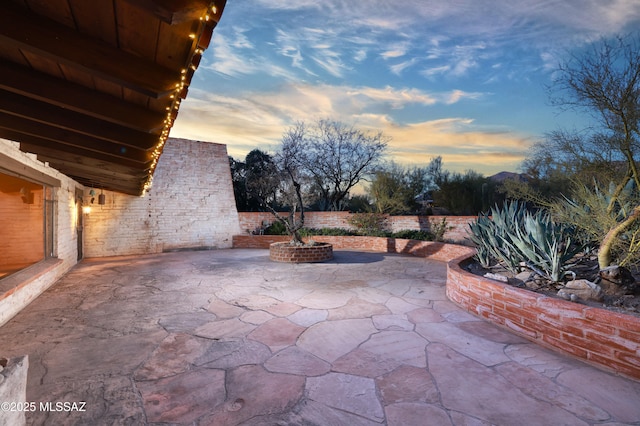 view of patio terrace at dusk