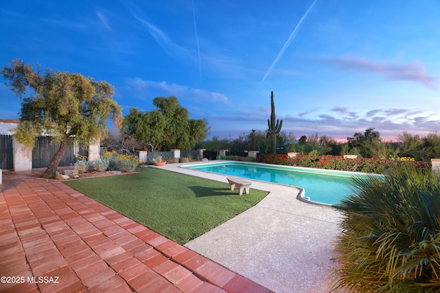 view of pool featuring a fenced in pool, a patio area, a fenced backyard, and a lawn