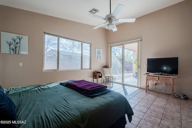 bedroom with light tile patterned floors, access to outside, visible vents, and ceiling fan