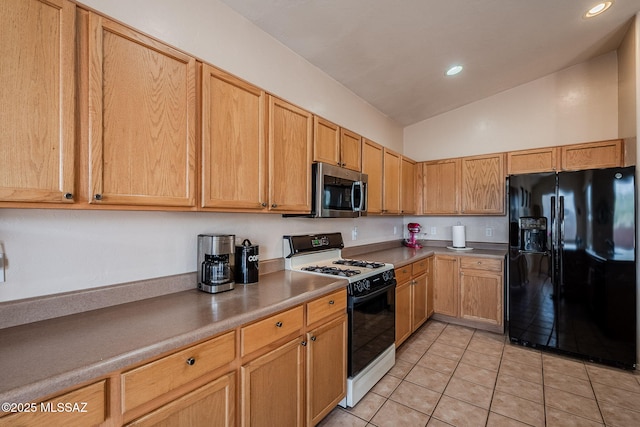 kitchen with light tile patterned floors, light countertops, stainless steel microwave, black fridge with ice dispenser, and gas stove