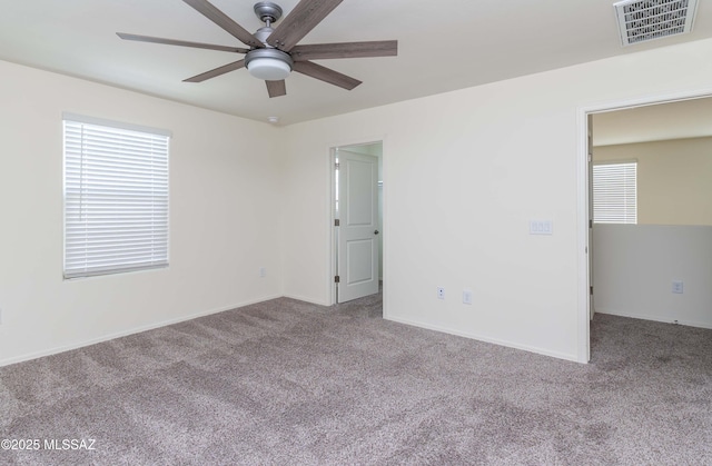 empty room with light carpet and ceiling fan