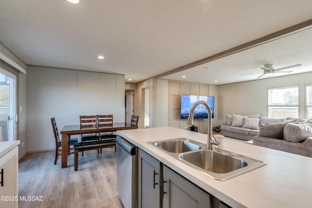 kitchen featuring gray cabinets, sink, dishwasher, and light hardwood / wood-style floors