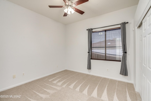 unfurnished room featuring ceiling fan, carpet flooring, and baseboards