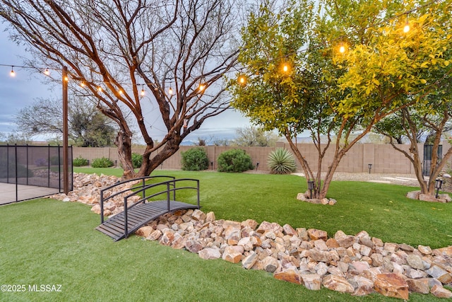 view of yard with a fenced backyard