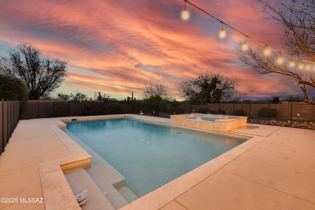 view of pool featuring a fenced in pool, a patio area, a fenced backyard, and an in ground hot tub