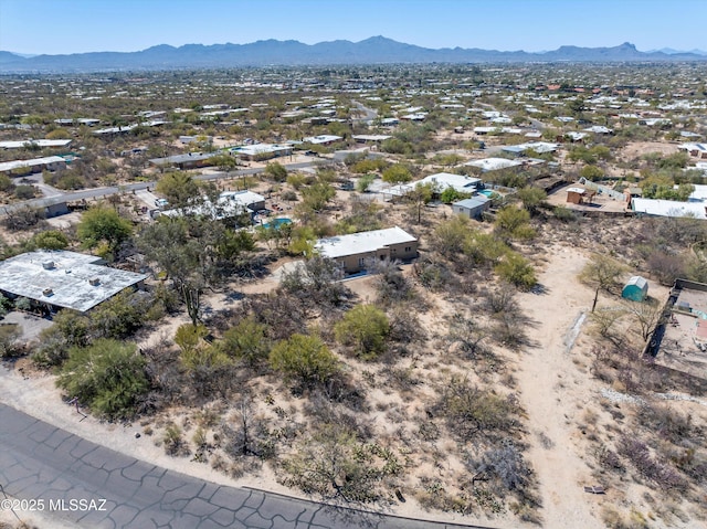 aerial view featuring a mountain view and view of desert