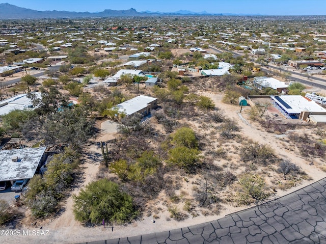 aerial view with a desert view and a mountain view