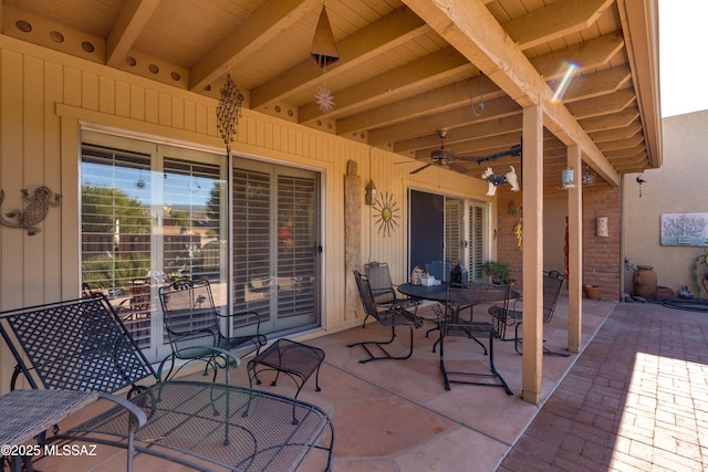 view of patio featuring ceiling fan and outdoor dining space