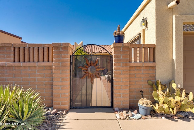 view of gate featuring fence