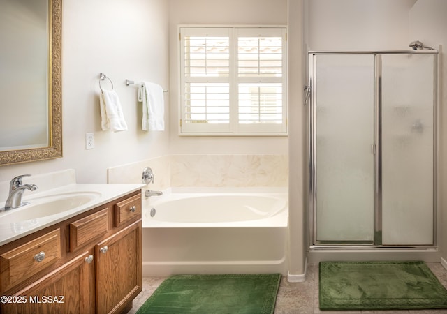 bathroom with a shower stall, vanity, and a bath