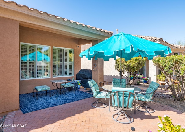 view of patio / terrace featuring outdoor dining area and area for grilling