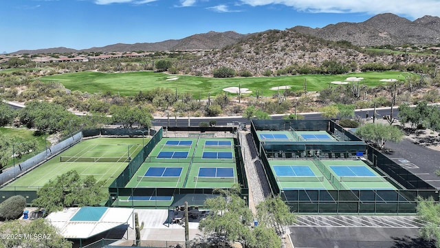 aerial view featuring view of golf course and a mountain view