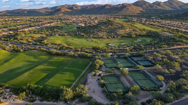 birds eye view of property featuring view of golf course and a mountain view