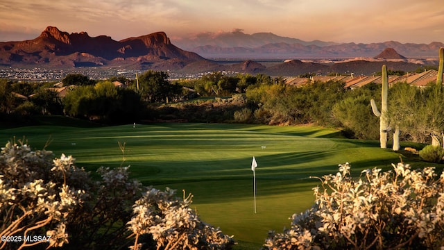 view of home's community with a mountain view and golf course view