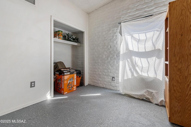 spare room with speckled floor and visible vents