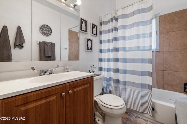 full bathroom featuring shower / tub combo, vanity, and toilet