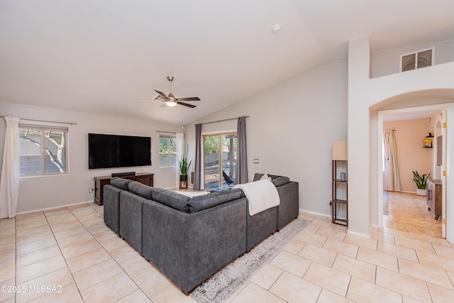 living room with visible vents, vaulted ceiling, a ceiling fan, and light tile patterned flooring