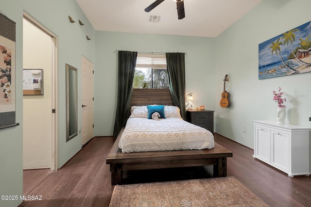 bedroom with ceiling fan and dark wood-type flooring