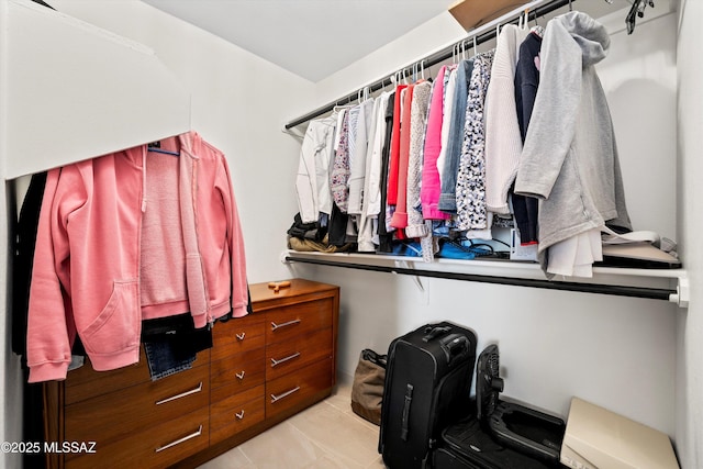 walk in closet featuring light tile patterned floors