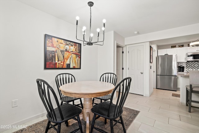 dining room with baseboards