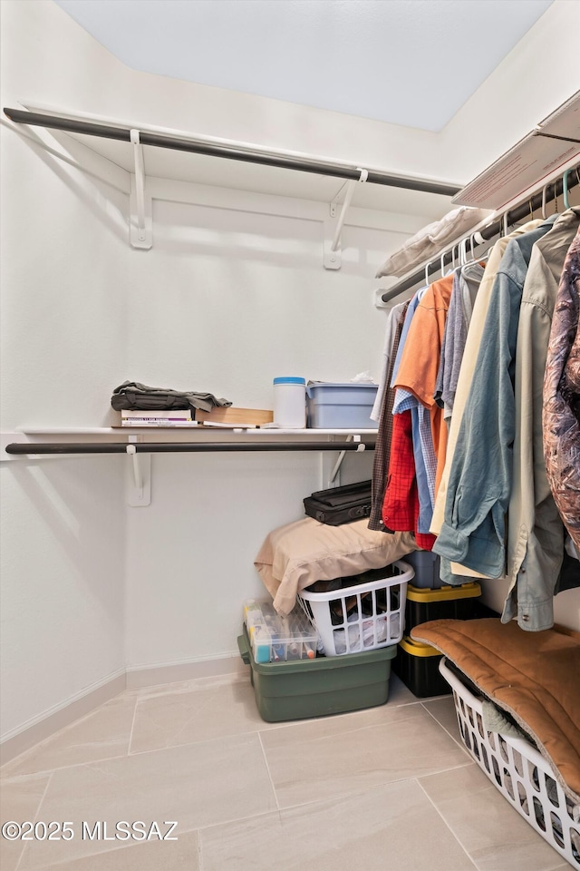 spacious closet with tile patterned flooring