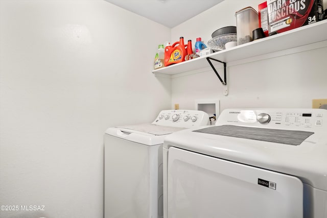 clothes washing area with laundry area and washing machine and dryer